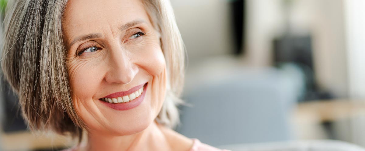 Woman smiling with dental implants Woman smiling with dental implants